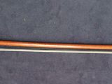 a wooden handle and a metal handle on the floor
