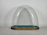 an image of a glass dome with a wooden base on a white surface