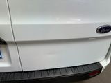 a close up of the rear end of a white car