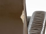 brown leather reclining chair with a leather seat and arm rest