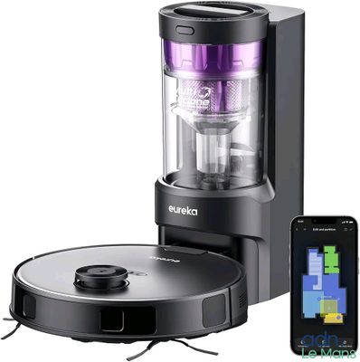 un robot noir et violet qui se trouve à côté d'un téléphone portable