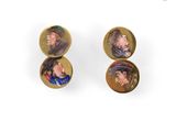 a pair of earrings with pictures of people on them
