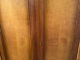 an image of a wooden cabinet with two doors
