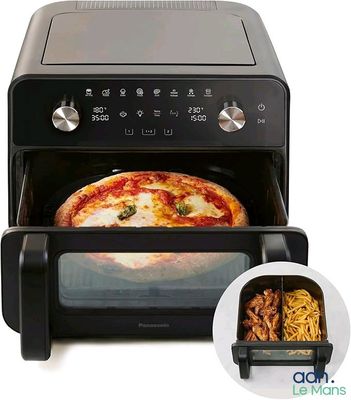 a pizza in the oven with a bowl of pasta