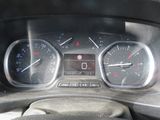 a close up of a car dashboard with a speedometer and gauges