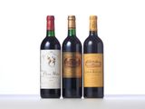 three bottles of wine are lined up on a table
