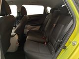 the back seats of a small car with a black seat belt