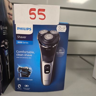 une boîte de rasoirs Philips sur une étagère dans un magasin