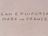a sign that says jean e pulfordat made in france on the side of a building