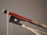 a bow that is attached to a string on a pole