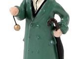 figurine représentant un homme vêtu d'un manteau vert et d'un chapeau, tenant un parapluie