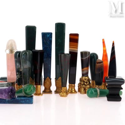 a lot of different colored vases sitting on a table