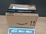 a box on top of a scale on a table