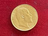 une pièce d'or sur laquelle figure le visage d'un homme