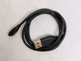 a close up of a black usb cable on a white surface