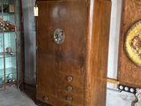 a wooden cabinet and a glass cabinet in a room