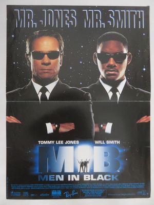 une affiche de cinéma pour « Men in Black », mettant en scène deux hommes en costume