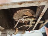 a close up of a metal pipe with a hose attached to it