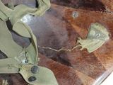 a close up of a wooden bowl with leaves on it