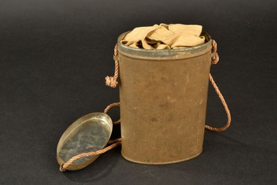 a metal container with a metal lid and a metal spoon in it