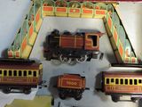 three toy trains sitting on a table next to each other
