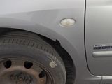 a close up of a car ' s tire on the street