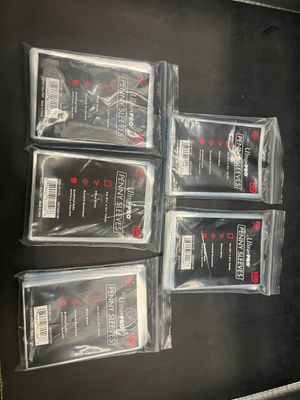 four bags of cigarettes are sitting on top of a black table