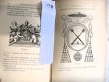 un livre ouvert sur lequel se trouve une feuille de papier
