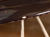a close up of a bike tire with a rusted surface