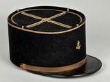an image of a black hat with a gold cross on it