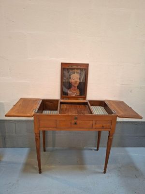 a small table with a picture on top of it