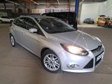 a picture of a silver ford focus parked in a garage