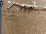 a pair of scissors and a piece of paper on a table