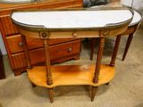 a table with a marble top on it in a room