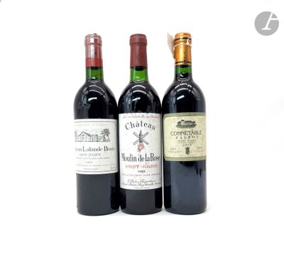 trois bouteilles de vin posées l'une à côté de l'autre sur une table