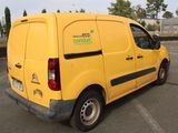 a yellow van that is parked in a parking lot