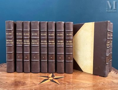 several books on a table with a star on top of them
