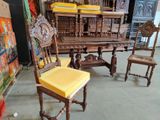 several chairs and a table in a room