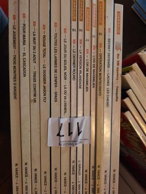 a lot of books that are stacked on top of each other