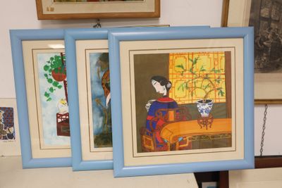 three framed pictures of a woman sitting on a couch