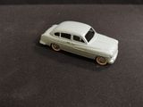 a toy car that is sitting on a black surface