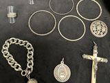 some of the silver items are laid out on the table