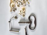 two keys and a key holder on a white surface