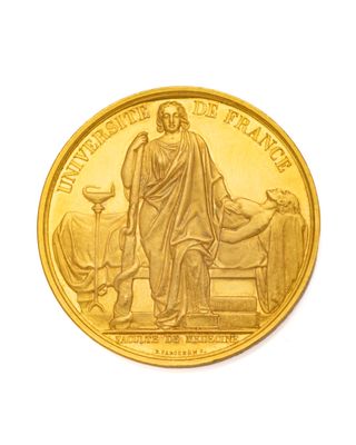 l'image d'une pièce d'or ornée d'une statue