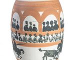 a vase that has a picture of a horse and people on it