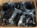 a cardboard box filled with lots of clamps and hoses