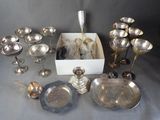 a lot of silver items that are on a table