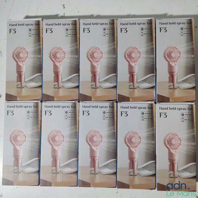 six boxes of hand held hair brushes on a wooden table