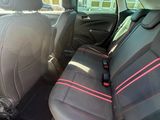 the back seats of a car are black with red trims