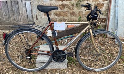 a bike that is parked in front of a building